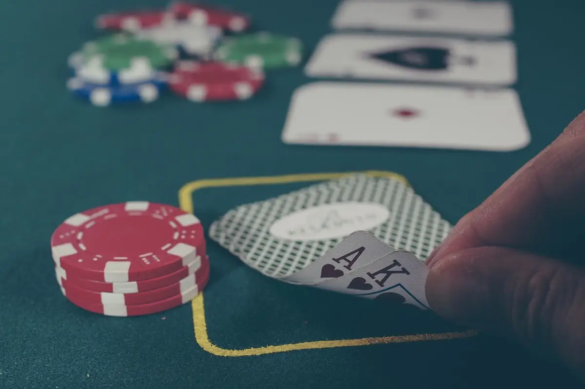 Playing cards and casino chips on a gaming table