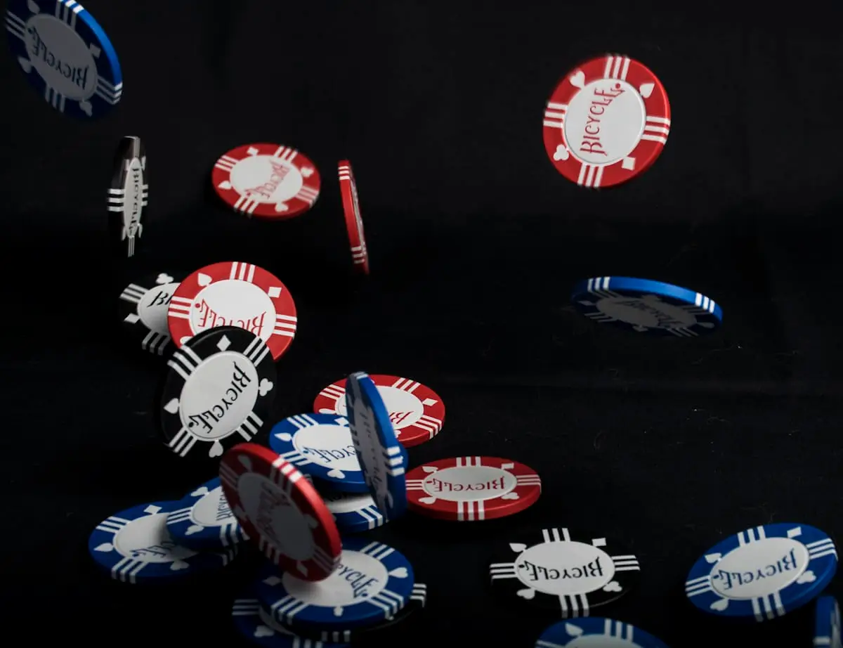 Casino chips arranged on a dark table