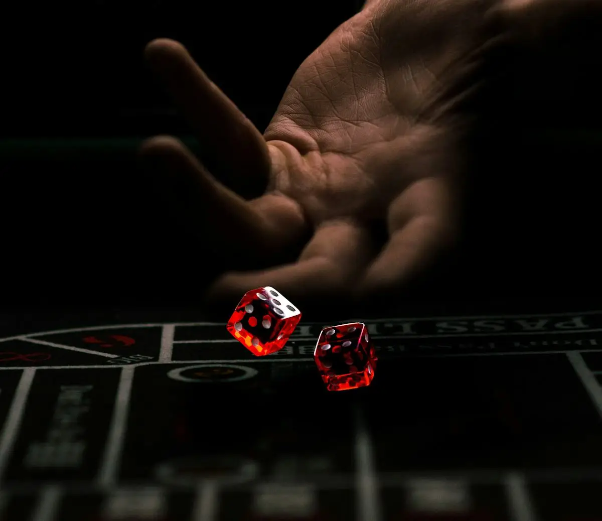 Casino dice held in a player hand